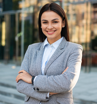 Learn Masters smiley businesswoman posing outdoors with arms crossed copy space 1