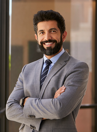 Learn Masters smiling hispanic businessman with arms crossed camera 1